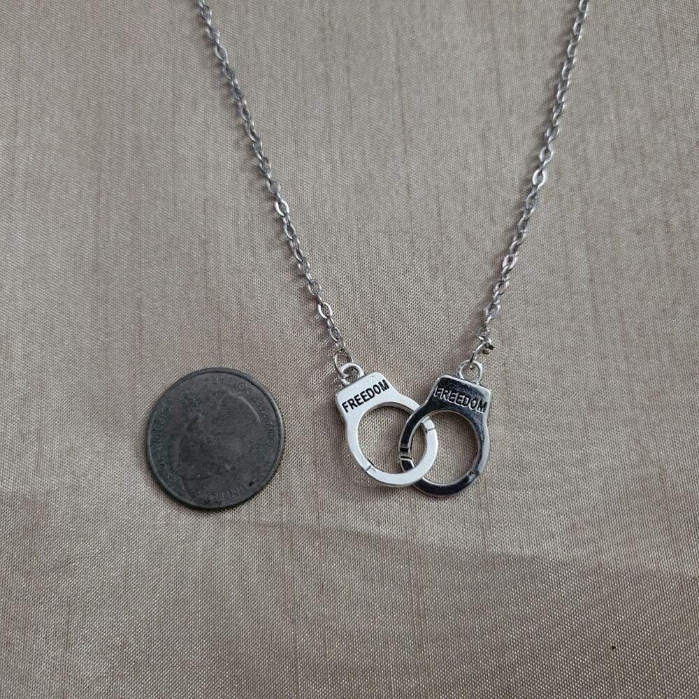 "Freedom" inscribed handcuff charm necklace - Picture 2 of 2